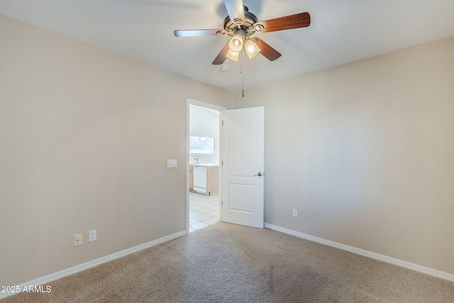43205 W Oster Dr, Maricopa, AZ 85138 - empty room with light carpet, ceiling fan, and baseboards