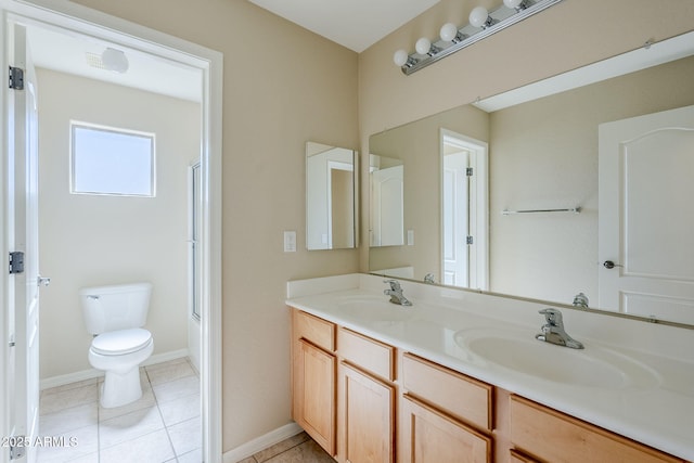 43205 W Oster Dr, Maricopa, AZ 85138 - full bathroom with double vanity, toilet, tile patterned floors, and baseboards