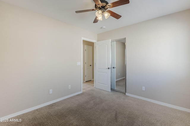 43205 W Oster Dr, Maricopa, AZ 85138 - unfurnished bedroom with light carpet, baseboards, a closet, and ceiling fan