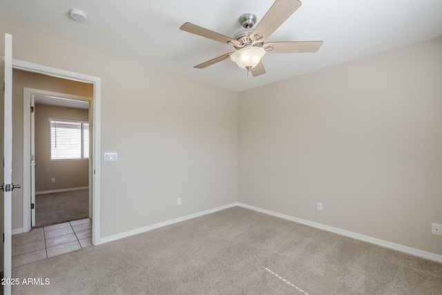 43205 W Oster Dr, Maricopa, AZ 85138 - spare room with light carpet, ceiling fan, baseboards, and a smoke detector