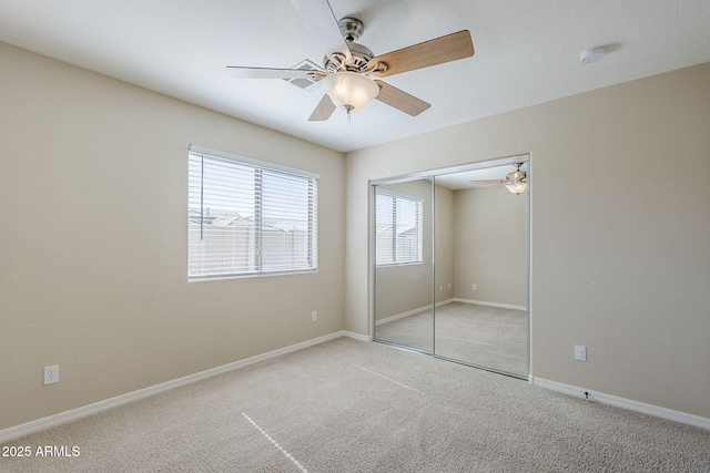 43205 W Oster Dr, Maricopa, AZ 85138 - unfurnished bedroom with carpet floors, a closet, ceiling fan, and baseboards