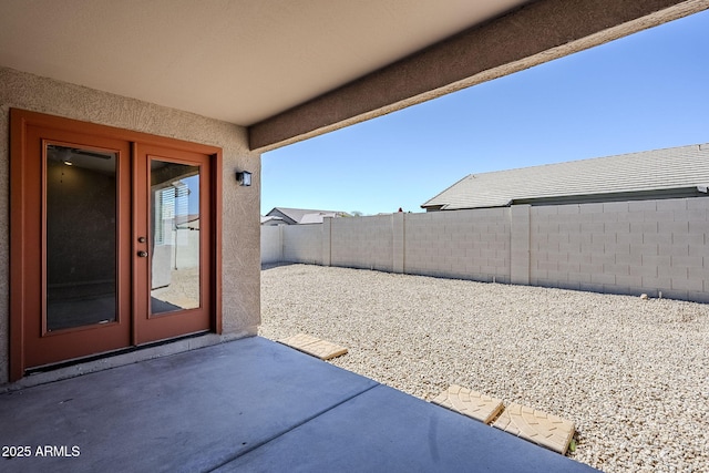 43205 W Oster Dr, Maricopa, AZ 85138 - fenced backyard featuring a patio area and french doors