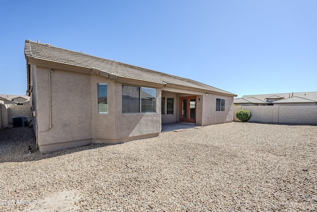 43205 W Oster Dr, Maricopa, AZ 85138 - back of house with central AC, stucco siding, a fenced backyard, and a patio area