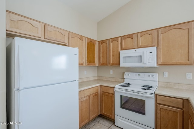 43205 W Oster Dr, Maricopa, AZ 85138 - kitchen with white appliances, light countertops, light brown cabinetry, and vaulted ceiling