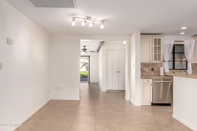 kitchen with dishwasher, decorative backsplash, light tile patterned floors, and ceiling fan