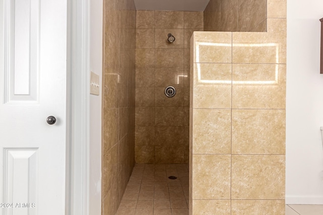 bathroom featuring a tile shower and tile patterned floors