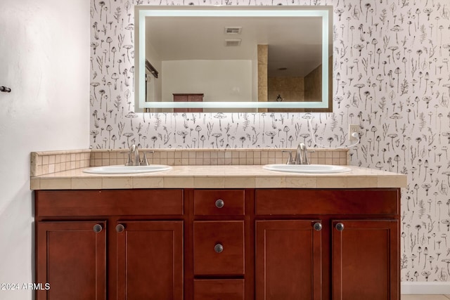 bathroom featuring decorative backsplash and vanity