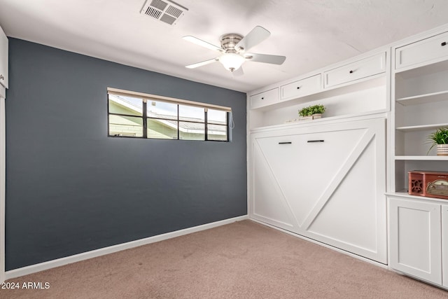 interior space featuring ceiling fan