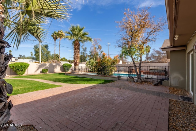 view of patio / terrace featuring a fenced in pool