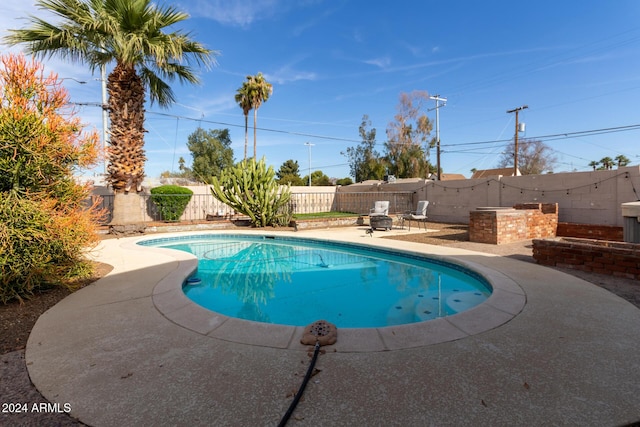 view of swimming pool featuring a patio area