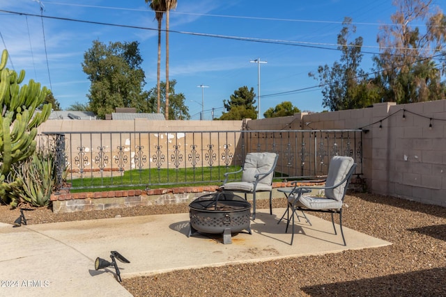 view of patio featuring an outdoor fire pit