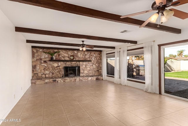 unfurnished living room with ceiling fan, beamed ceiling, and light tile patterned flooring