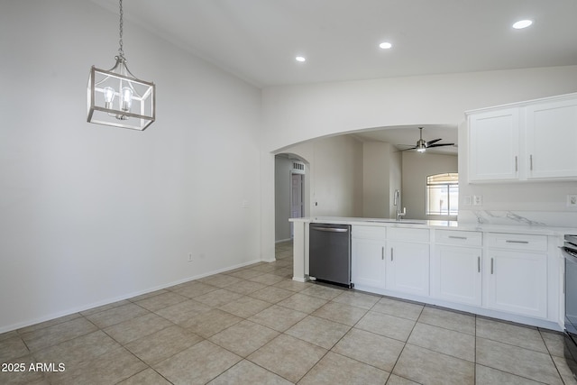 kitchen featuring stainless steel dishwasher, a sink, arched walkways, ceiling fan with notable chandelier, and vaulted ceiling
