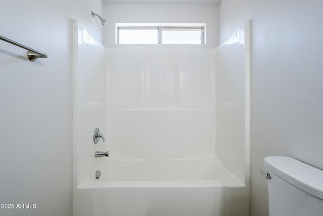 bathroom with shower / bath combination and toilet