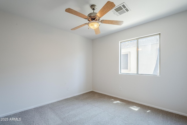 carpeted empty room featuring a ceiling fan, baseboards, and visible vents