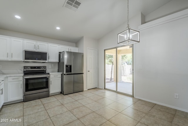 kitchen with pendant lighting, stainless steel appliances, visible vents, and white cabinetry