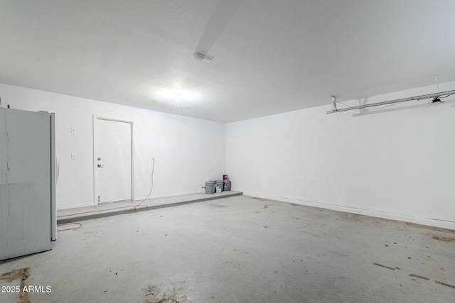 garage with freestanding refrigerator