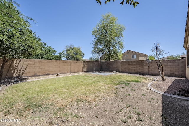 view of yard with a fenced backyard