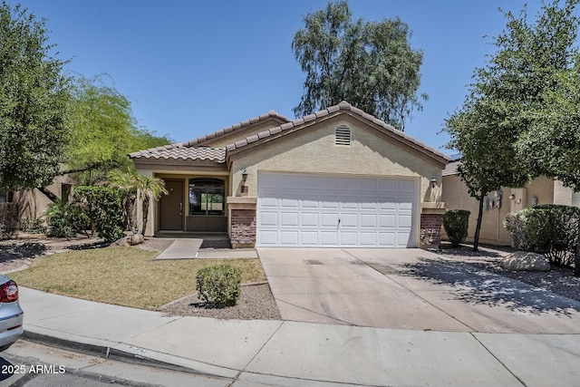 ranch-style house featuring an attached garage, stucco siding, a tile roof, and concrete driveway