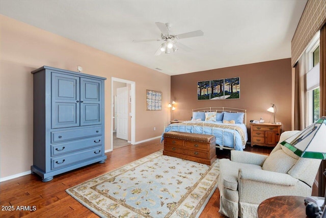 bedroom featuring ceiling fan and dark hardwood / wood-style flooring