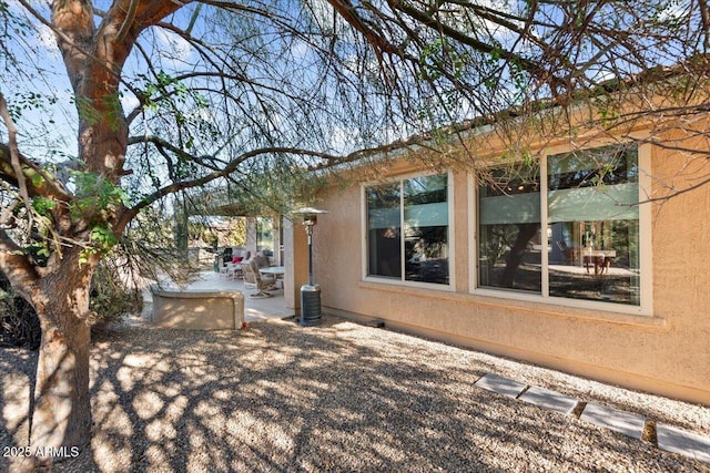 view of home's exterior with a patio