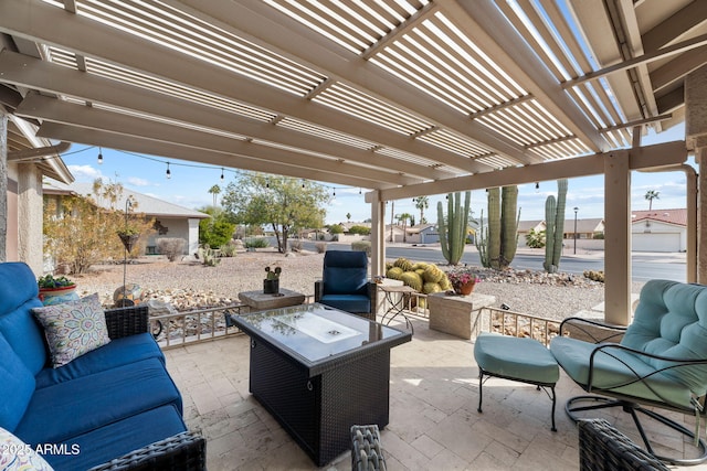 view of patio / terrace featuring a pergola and an outdoor living space with a fire pit