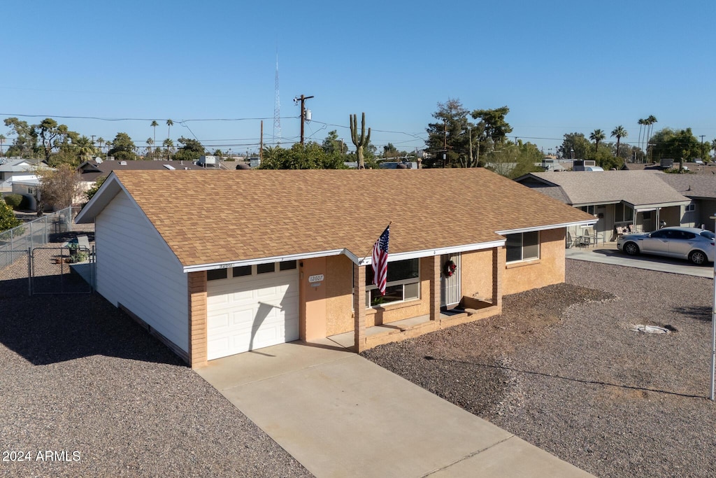 ranch-style house featuring a garage