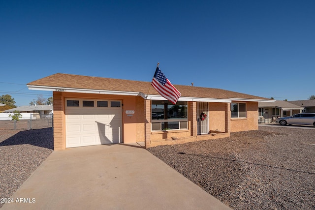 single story home with a garage