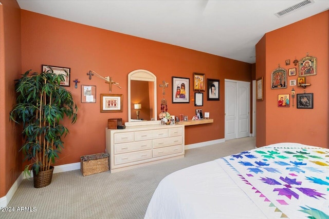 bedroom with light colored carpet