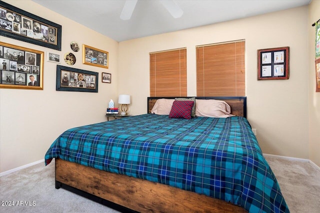 bedroom with ceiling fan and light carpet