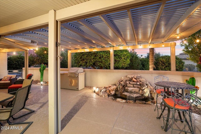 patio terrace at dusk with a pergola