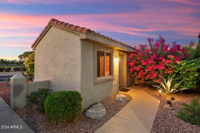 view of property exterior at dusk