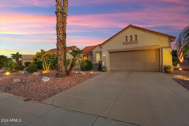 view of front of property with a garage