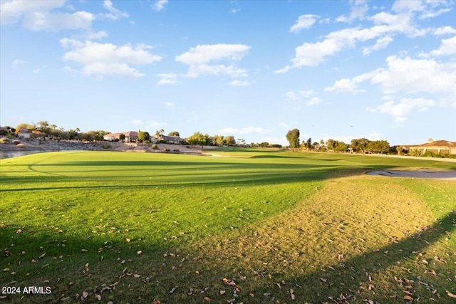 view of home's community featuring a lawn