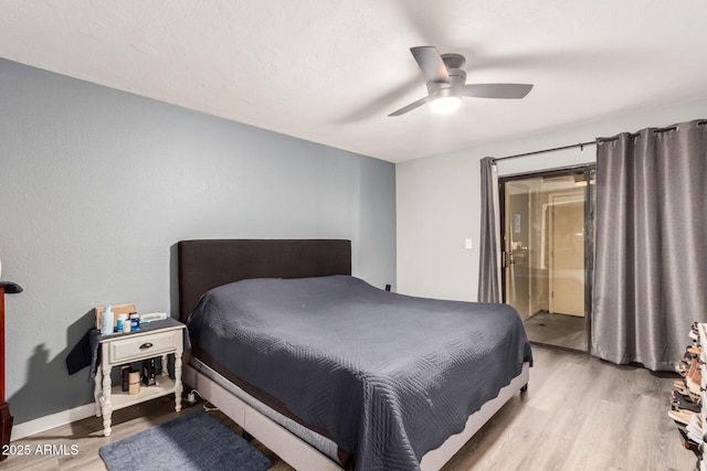 bedroom featuring light wood-type flooring, a ceiling fan, and baseboards