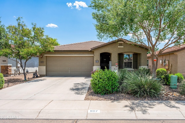 907 E Kelsi Ave, San Tan Valley, AZ 85140 - view of front of property featuring stucco siding, a garage, driveway, and a tiled roof