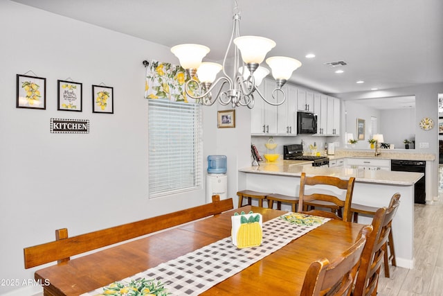 907 E Kelsi Ave, San Tan Valley, AZ 85140 - dining space featuring light wood finished floors, recessed lighting, a chandelier, and baseboards
