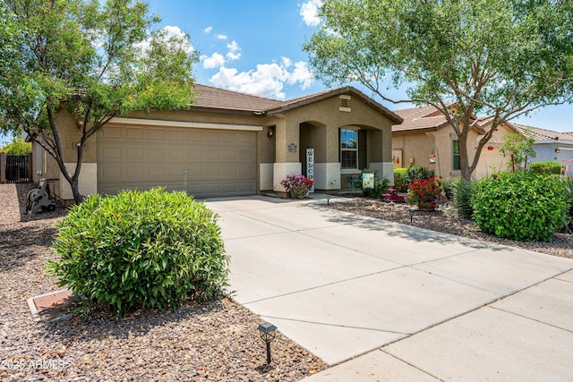907 E Kelsi Ave, San Tan Valley, AZ 85140 - view of front of house featuring stucco siding, an attached garage, driveway, and a tile roof