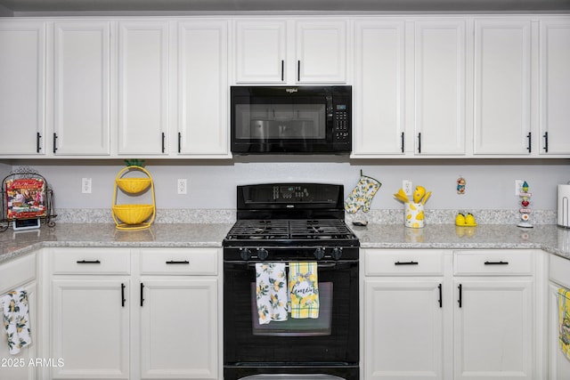 907 E Kelsi Ave, San Tan Valley, AZ 85140 - kitchen with black appliances, white cabinets, and light stone countertops