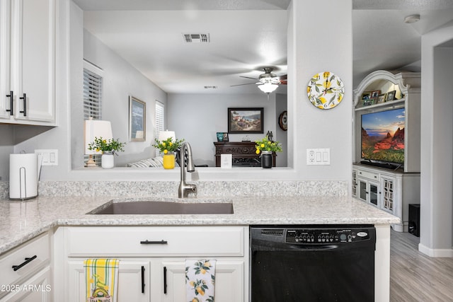 907 E Kelsi Ave, San Tan Valley, AZ 85140 - kitchen featuring dishwasher, a sink, a ceiling fan, white cabinets, and wood finished floors