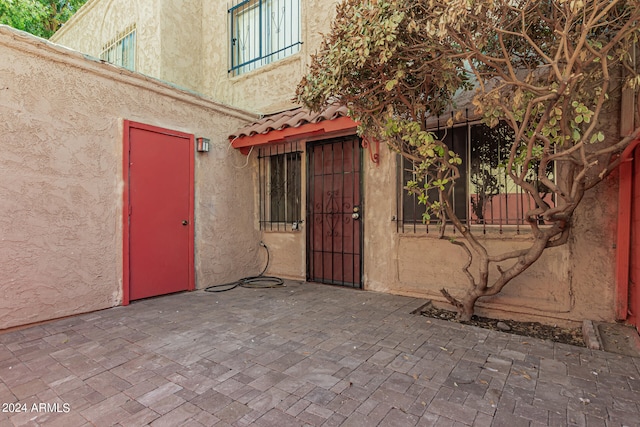 doorway to property with a patio