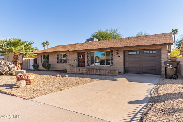 ranch-style home featuring a garage