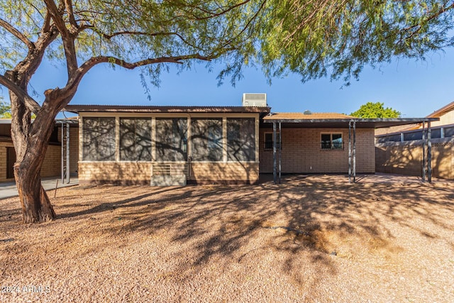 back of house with a sunroom