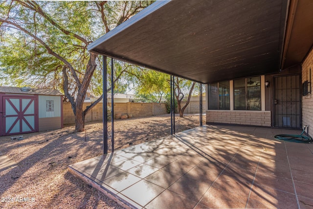 view of patio / terrace featuring a storage shed