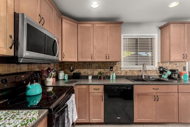 kitchen with sink, tasteful backsplash, dark stone countertops, light tile patterned flooring, and black appliances