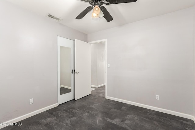 unfurnished bedroom featuring ceiling fan