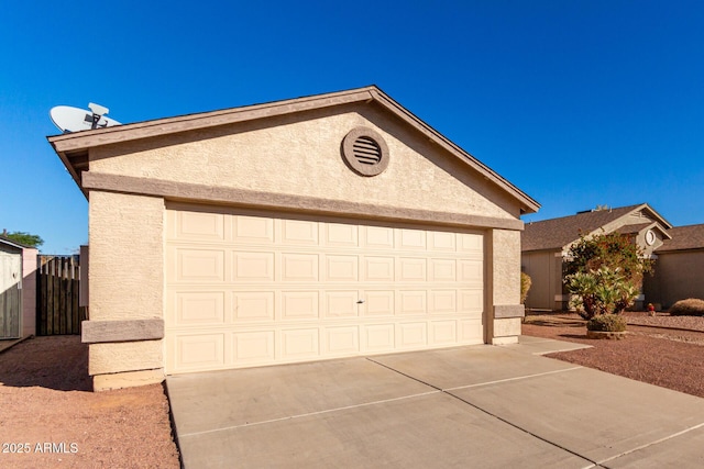 view of front of property with a garage and an outdoor structure