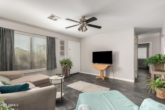 living room with ceiling fan and ornamental molding