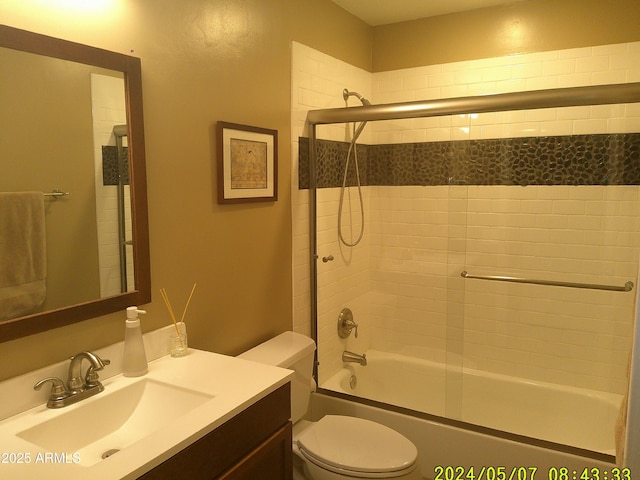 8700 E Mountain View Rd Unit 2029, Scottsdale, AZ 85258 - bathroom featuring toilet, vanity, and combined bath / shower with glass door