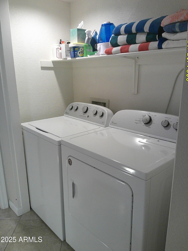 8700 E Mountain View Rd Unit 2029, Scottsdale, AZ 85258 - washroom with washer and dryer and light tile patterned floors